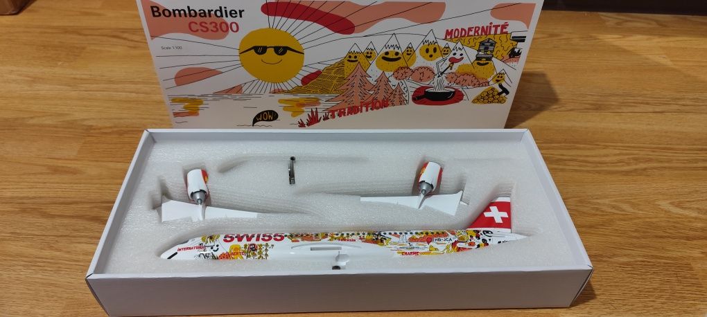 Modelo Suíço Bombardier CS300 – SWISSxFichtre Romandie Livery (1:100)