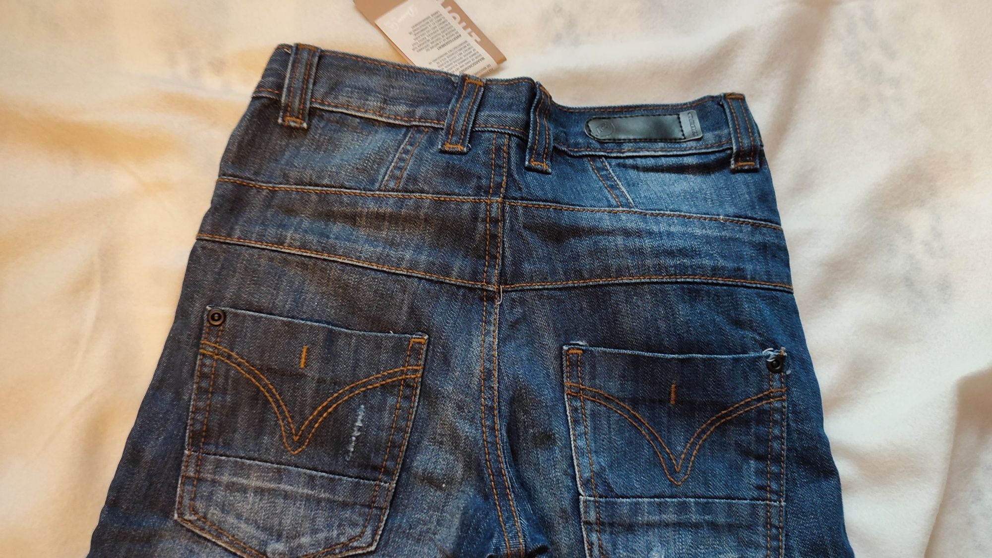 nowe spodnie jeansowe  (ciemny jeans)