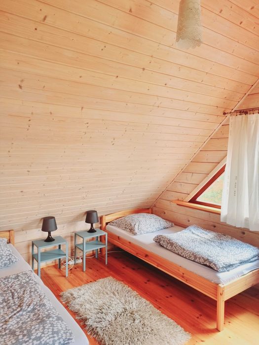 Domek nad jeziorem z linią brzegową na Mazurach Ryn Rybical - Staś