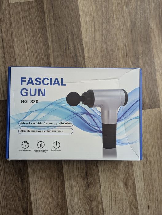 М'язовий масажний пістолет.