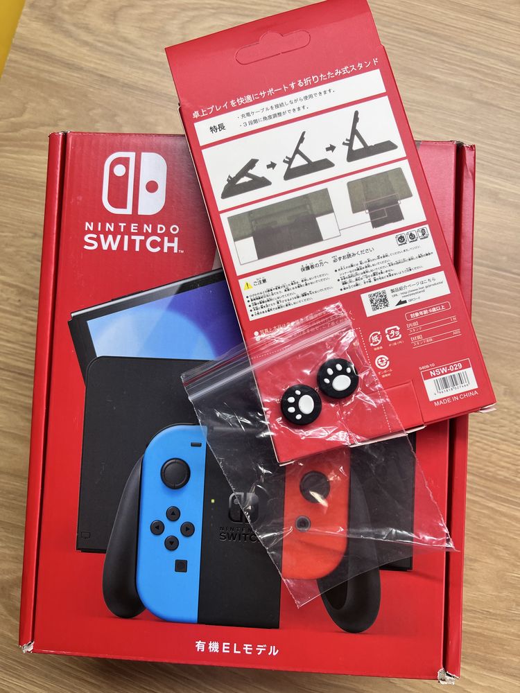Nintendo Switch OLED (нова)  +фірмова підставка +накладки на стіки
