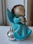 Anjo azul com nuvem prateada. Produto de ourivesaria.