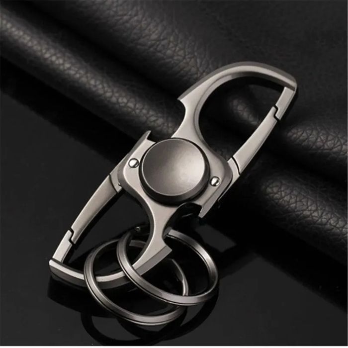 Fidget spinner, keychain/bottle opener, stress relief gadget,
