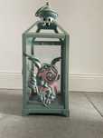 Zielony lampion metalowy