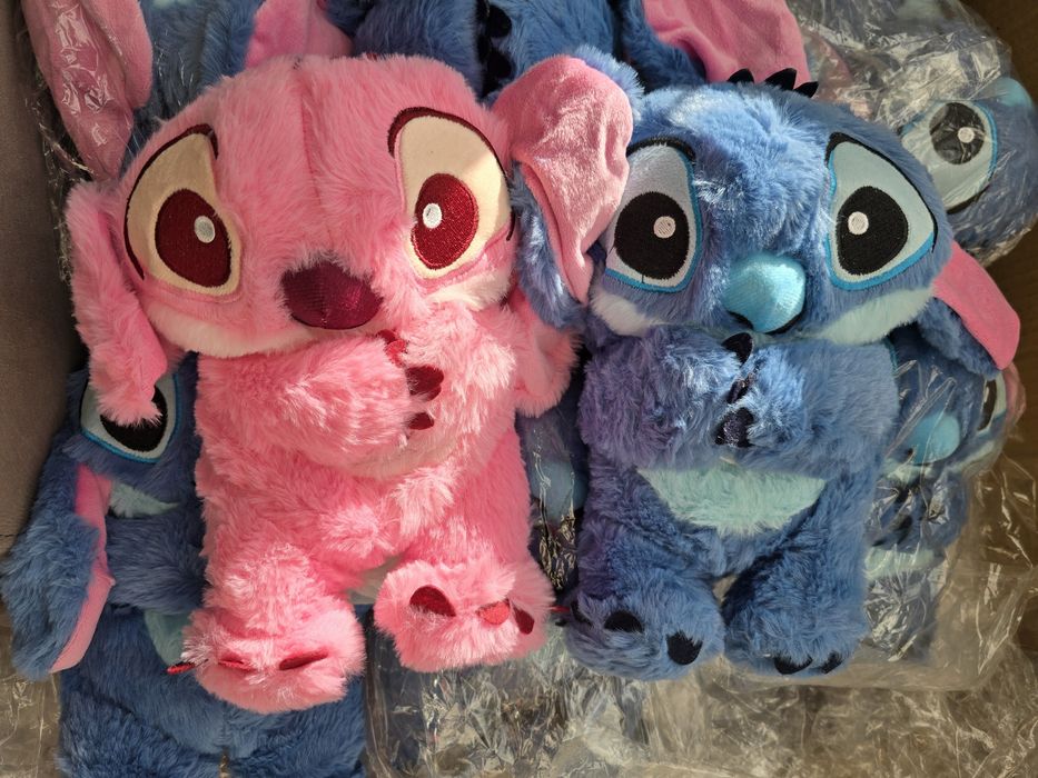 Рожевий дихаючий стіч, світиться, грають мелодії, дихає