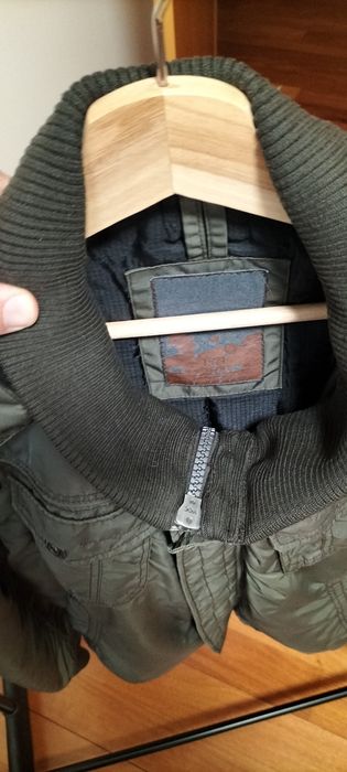 Blusão verde em bom estado