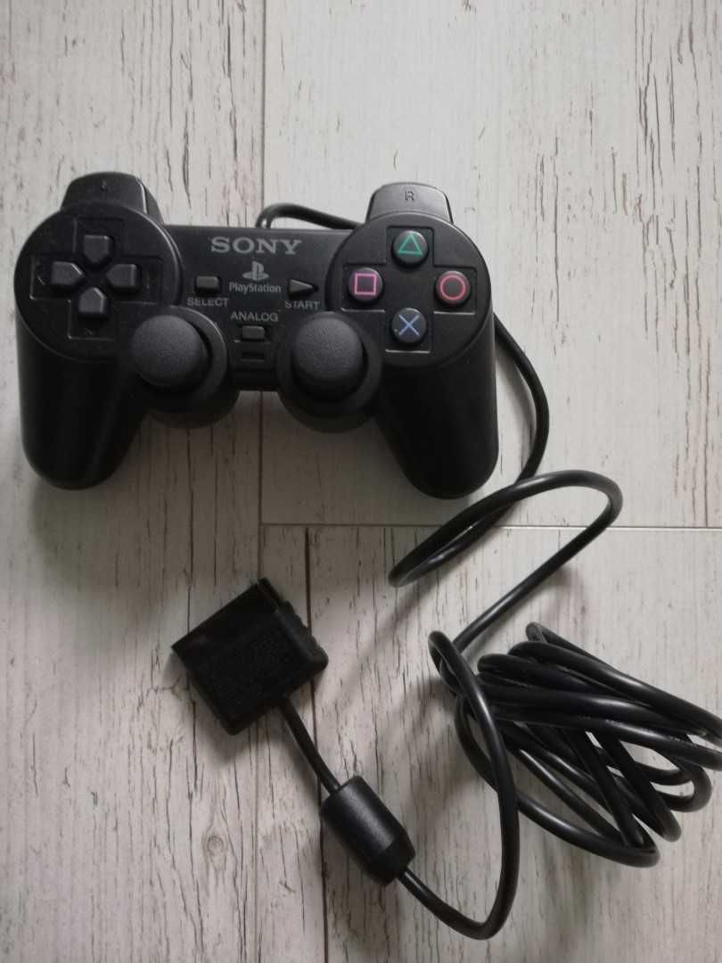 Konsola PlayStation 2 slim + pad + 2 memorki + kabel Component + 4 gry