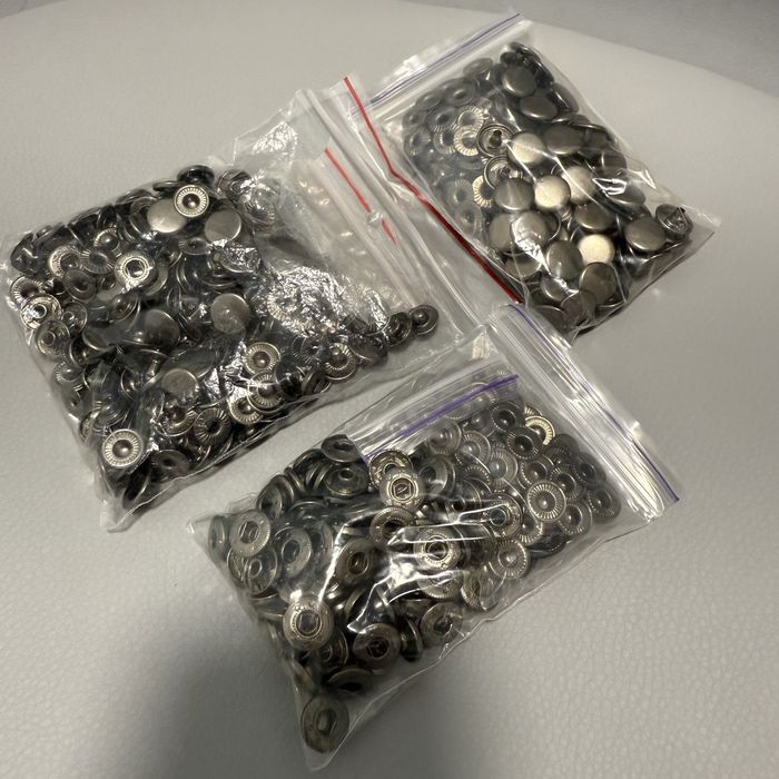 Люверси та кнопки