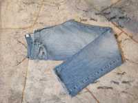 Męskie jasne spodnie jeansowe marki Tommy Hilfiger