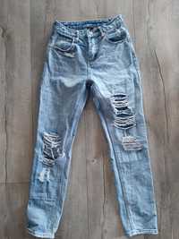 Spodnie jeansy jeansowe z dziurami r. Xs 34