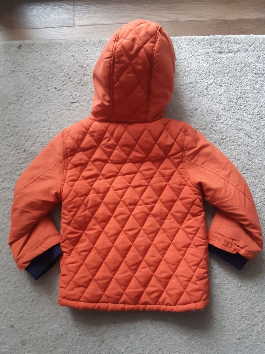 Pomarańczowa zimowa kurtka dla chłopca rozm 110