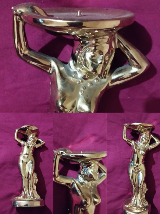 Подсвечник покрыт позолота.