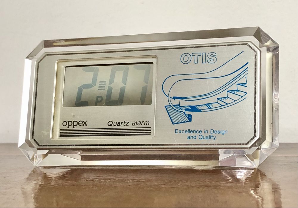 Retro zegarek budzik LCD kwarcowy Oppex reklama OTIS przeźroczysty vtg