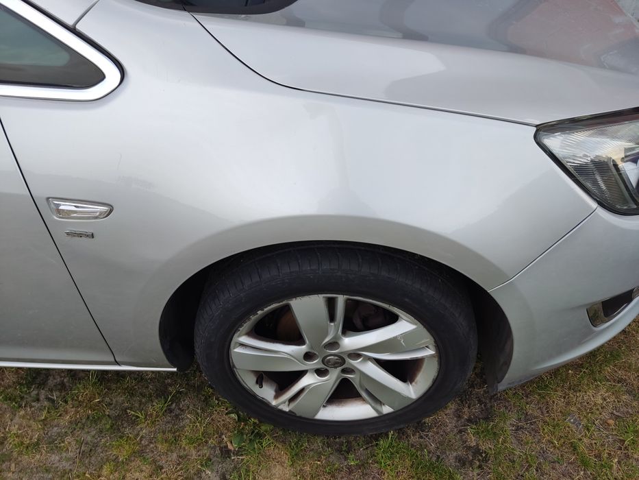 Opel Astra J błotnik prawy lewy Z176