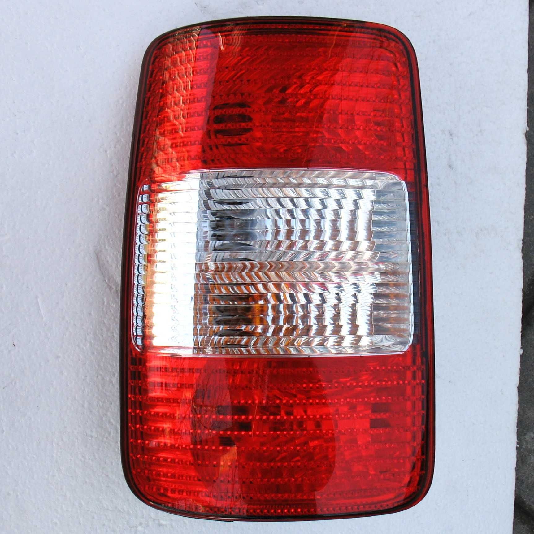 VW Caddy III 04-10 lampa Lewa tył oryginał EU