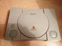 Playstation com jogos e comandos