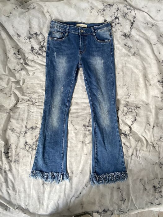 Spodnie jeansowe flare vintage/retro z przetarciami
