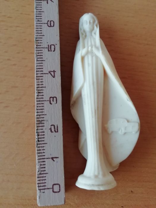 Santa para tablier de automóvel e crucifixo.