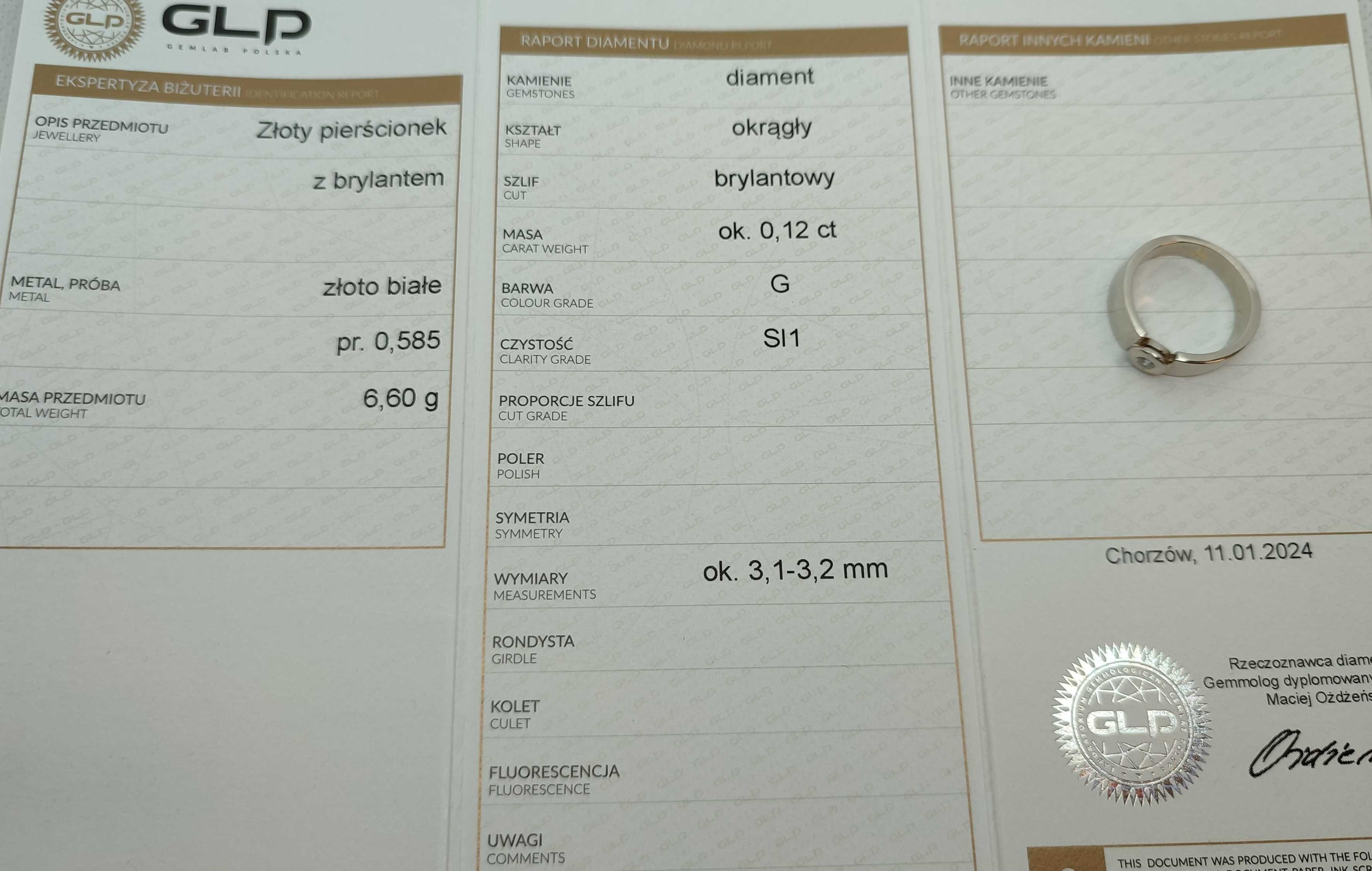 Złoty pierścionek z brylantem 6,62g p585 r.14,5 / diament/ białe złoto