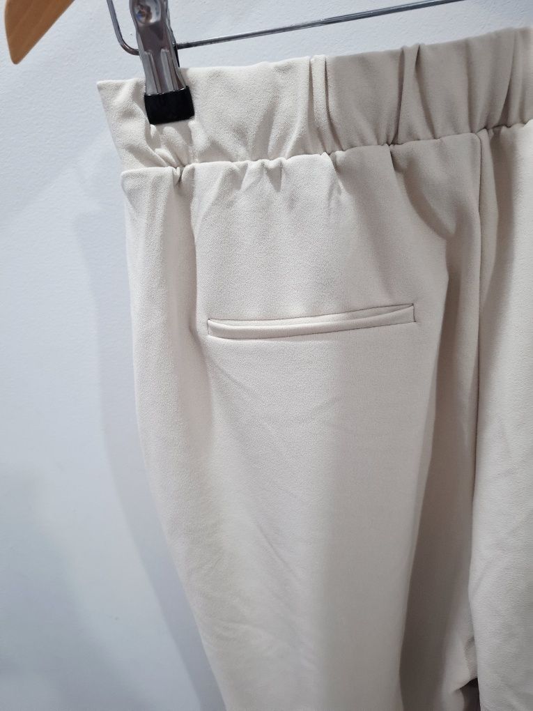 Nowe beżowe spodnie casual reserved l 40