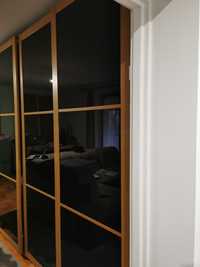 Szafa PAX szerokość 150cm z przesuwanymi drzwiami z czarnego szkła