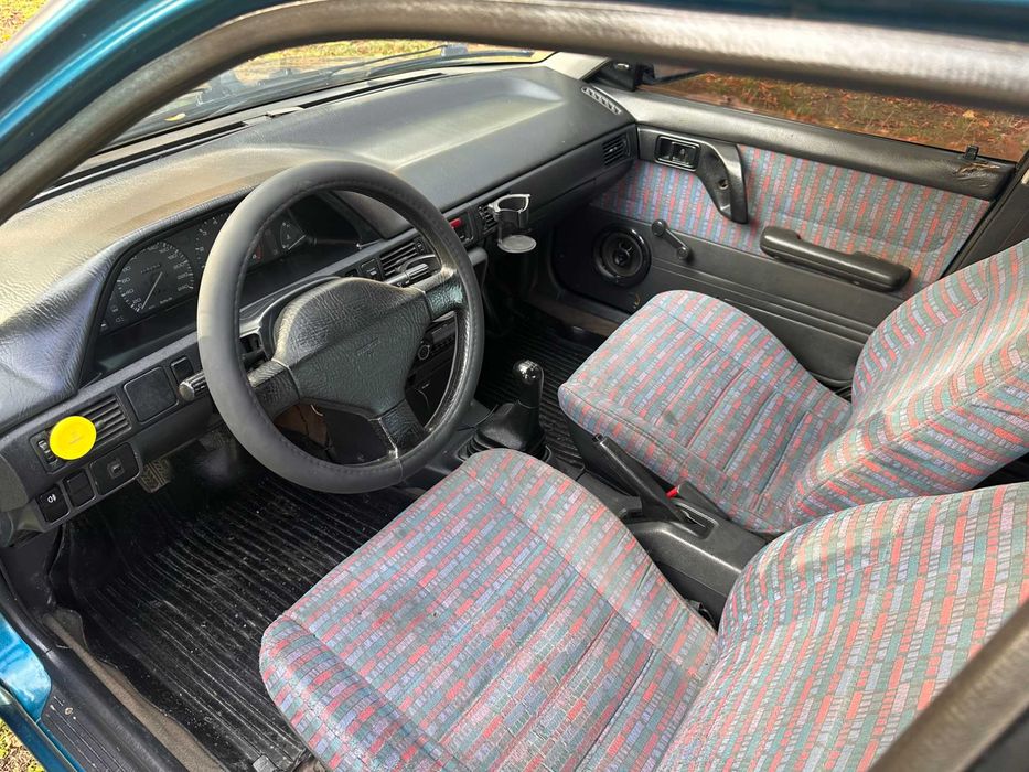 Mazda 323 расход 7л/100км