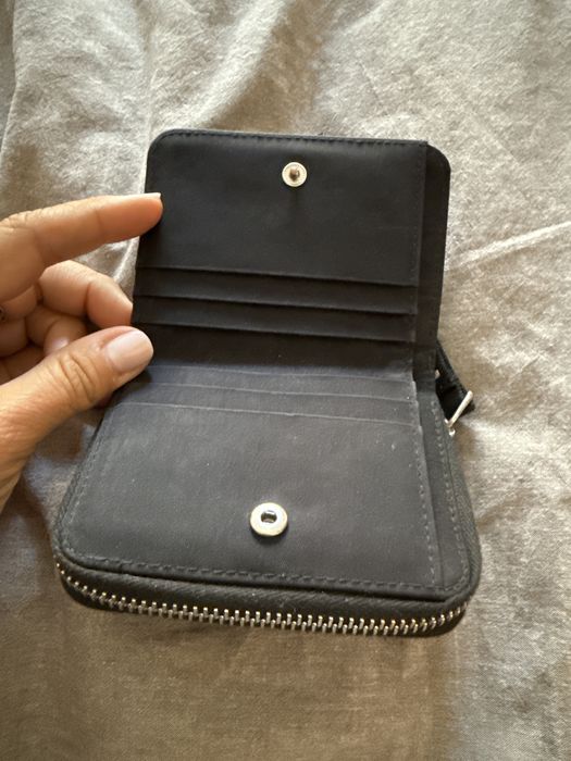 Carteira preta para cartoes notas e moedas