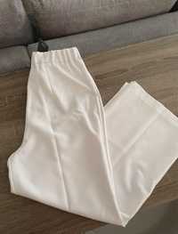 białe cienkie spodnie garniturowe materiałowe z kantem butik