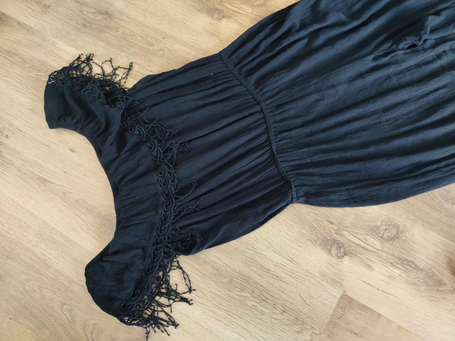 Czarny elastyczny kombinezon z szerokimi nogawkami plus size