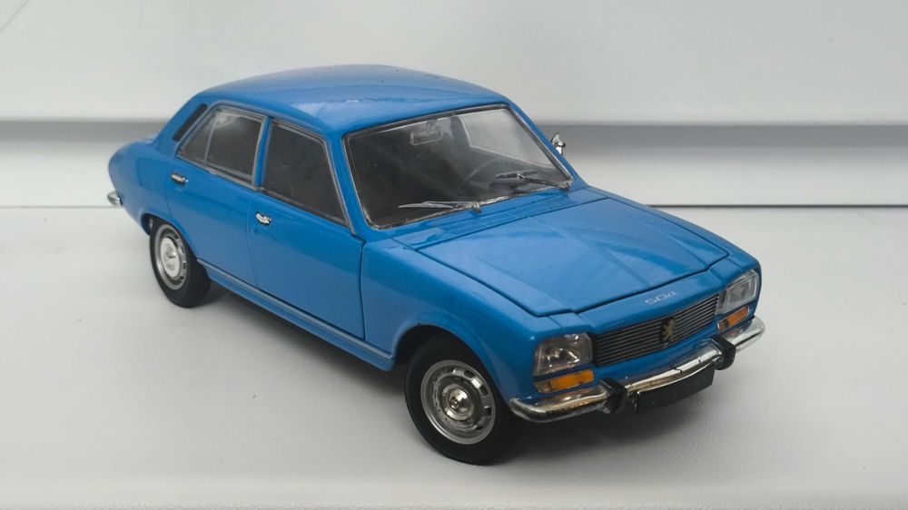 Модель, машинка Peugeot 504 1975 1.24 Welly