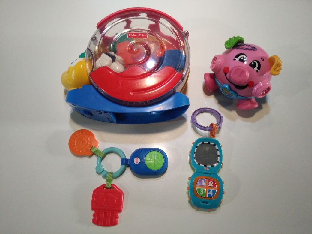 Zestaw zabawek Fisher-Price ślimak klocki świnka pilot telefon.