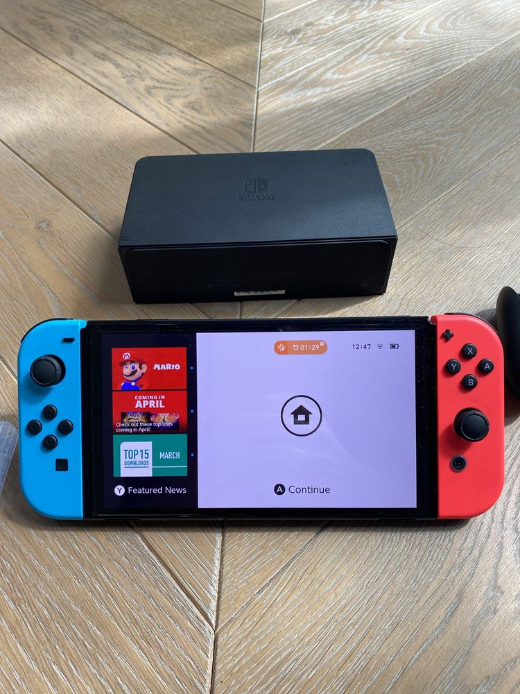 Nintendo Switch OLED (+futerał, gry; stan idealny)