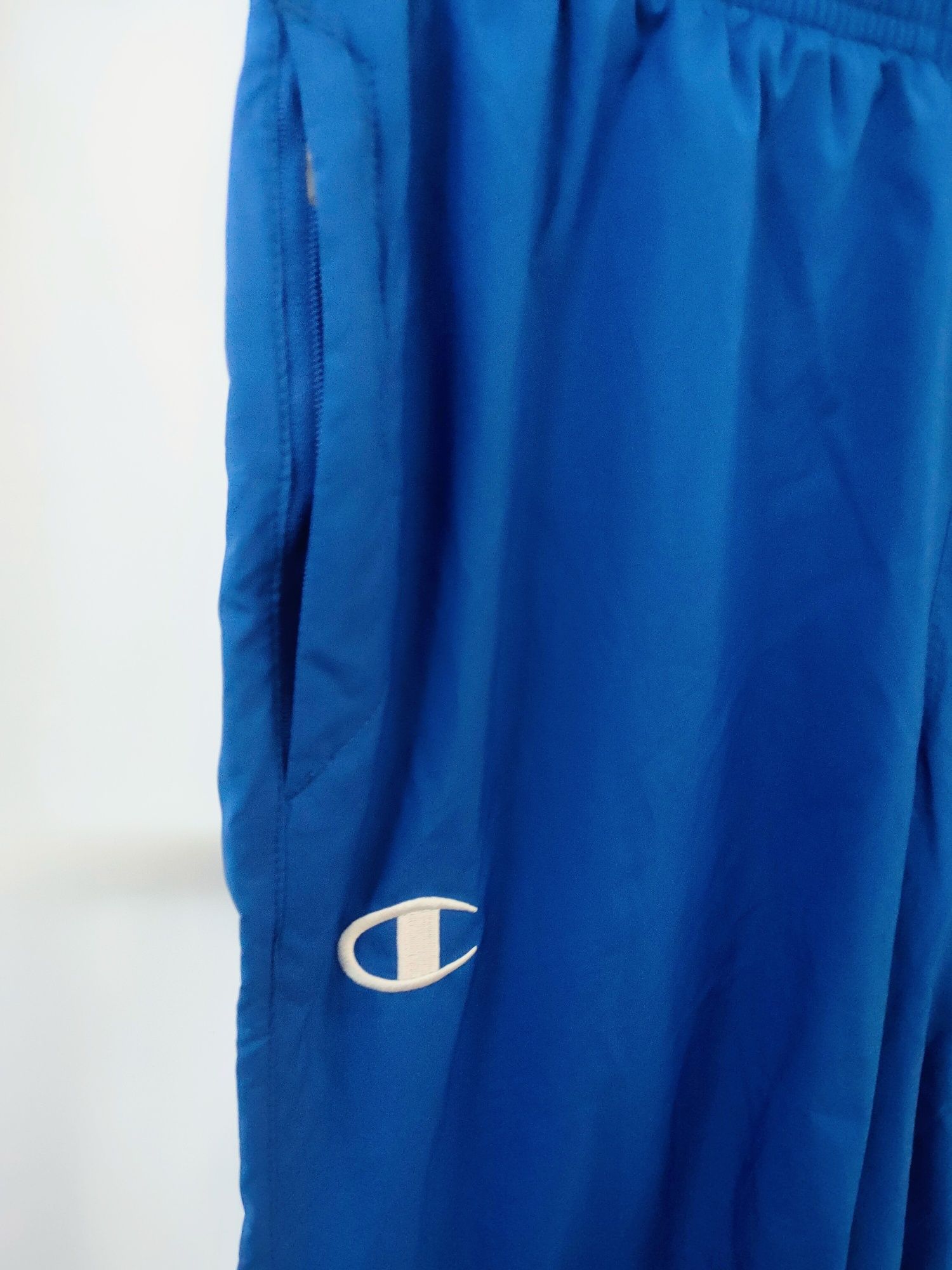 Nowe Spodnie dresowe Champion unisex S