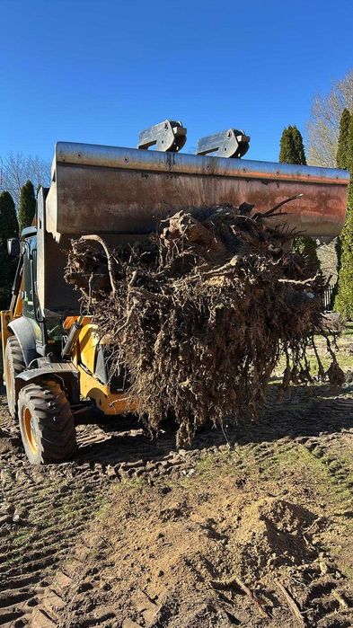 Usługi koparko-ładowarką. Ziemia transport wywrotka.