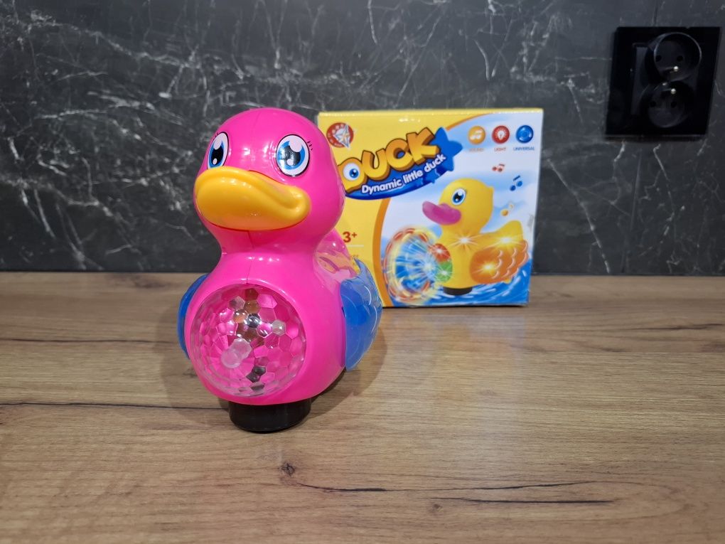 Kaczka gra świeci jeździ różowa dla dzieci