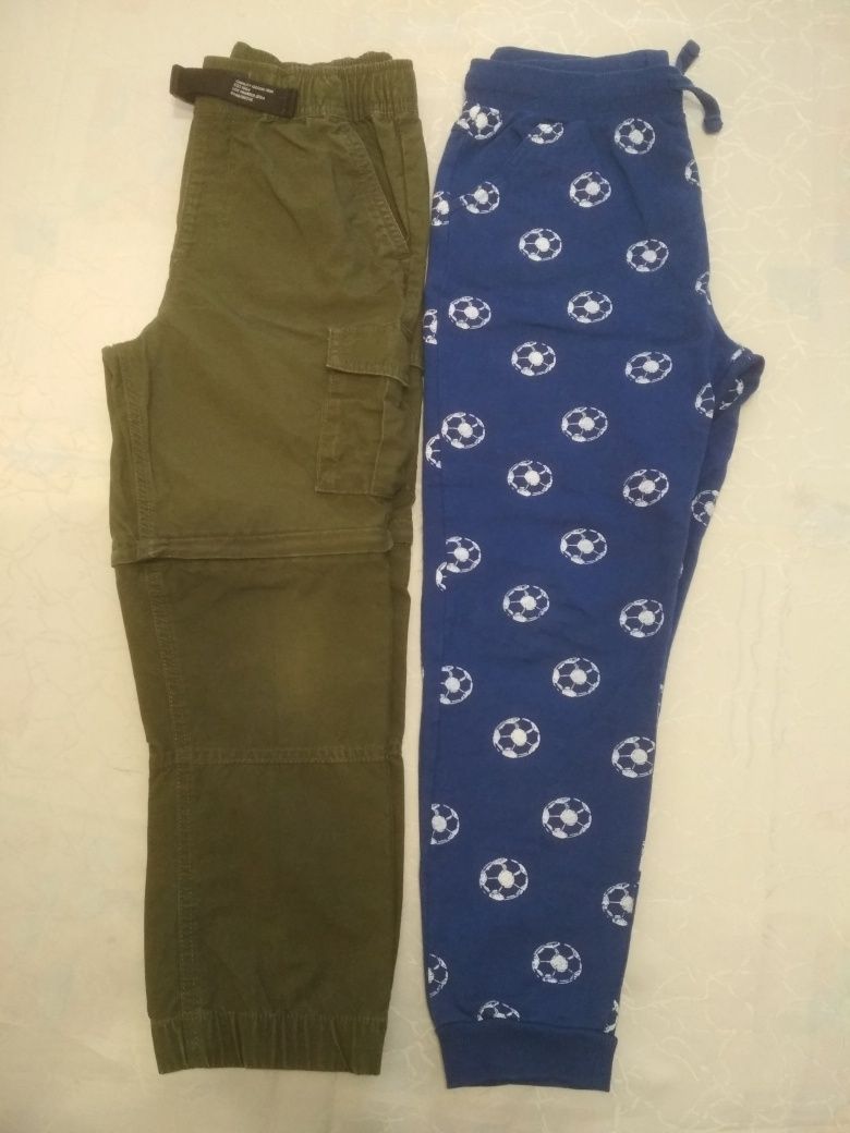 Spodnie chłopięce r 122 /128 z odpinanymi  nogawkami i  dresowe.