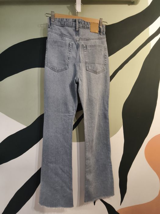 Sinsay jeansy flare z dziurami 32 nowe