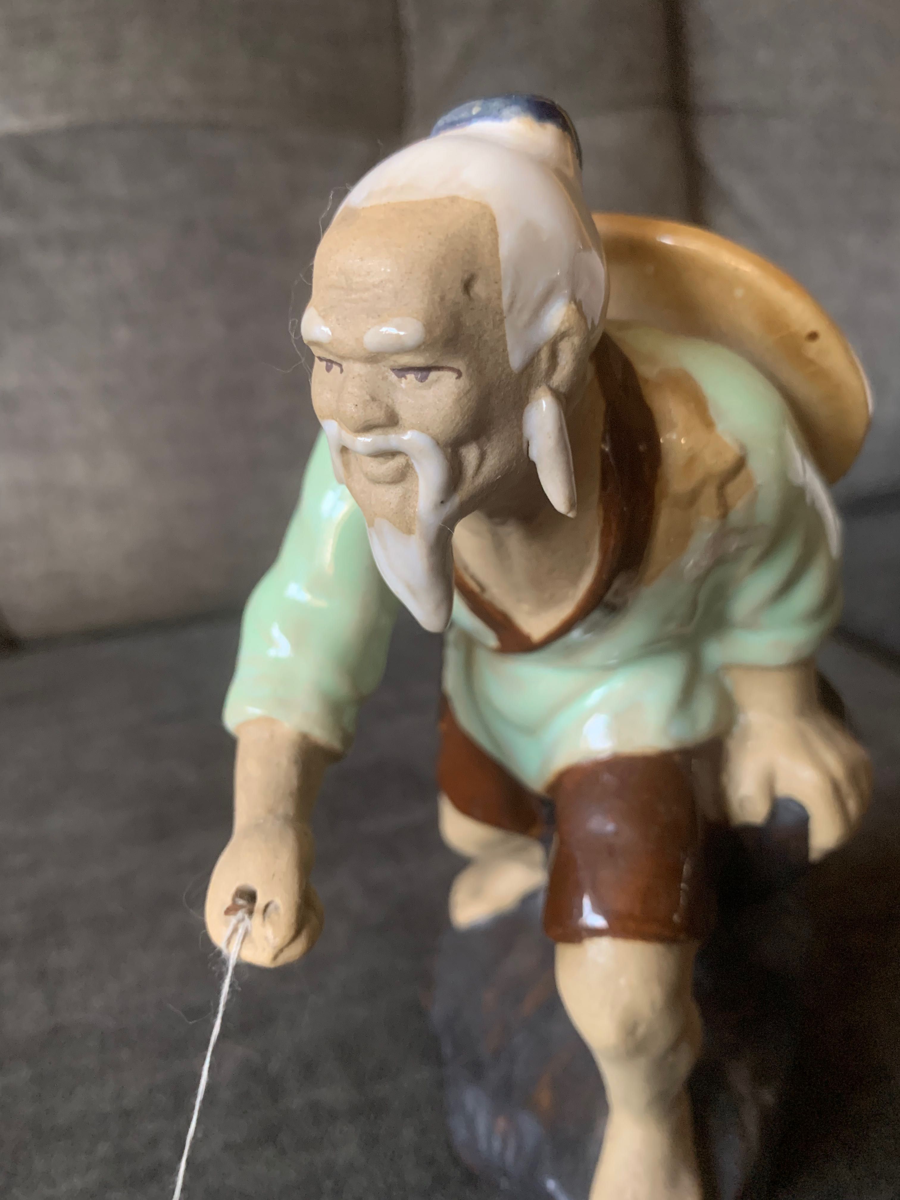 Figurka porcelanowa Rybak z wędką z rybką