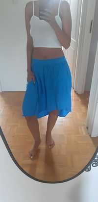 Niebieska asymetryczna spódnica Carry z kieszeniami