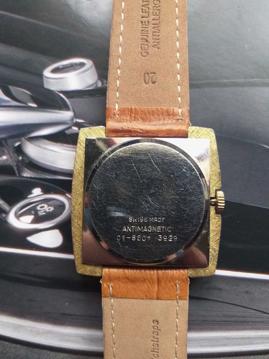 relogio newmark corda manual