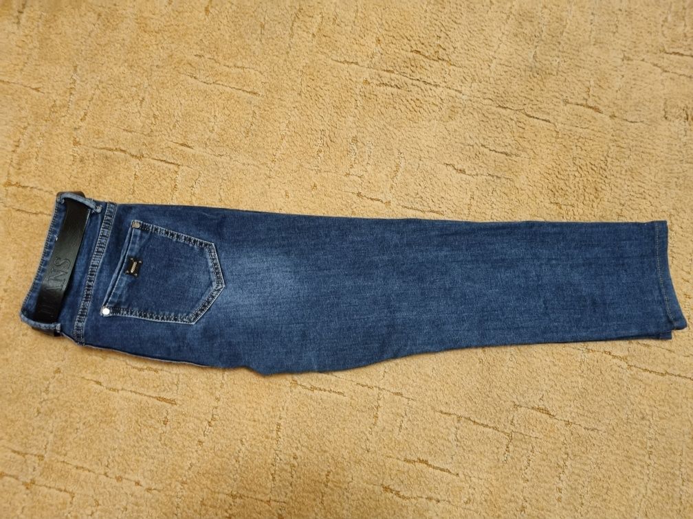 Сині джинсові штани