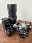 Pentax Super ME lustrzanka + cztery obiektywy + pokrowce + skrzynia