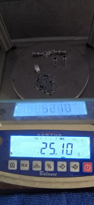 Срібний хрестик на шовковому шнурку