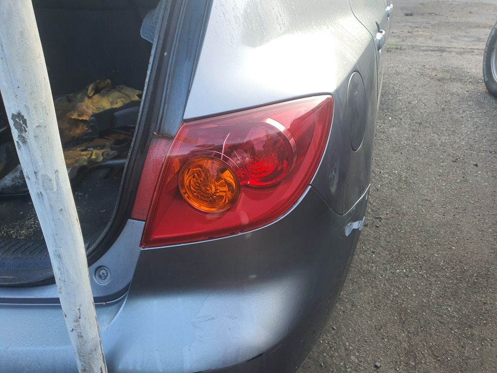 Lampa tyl w blotnik Mazda 3 BK hb