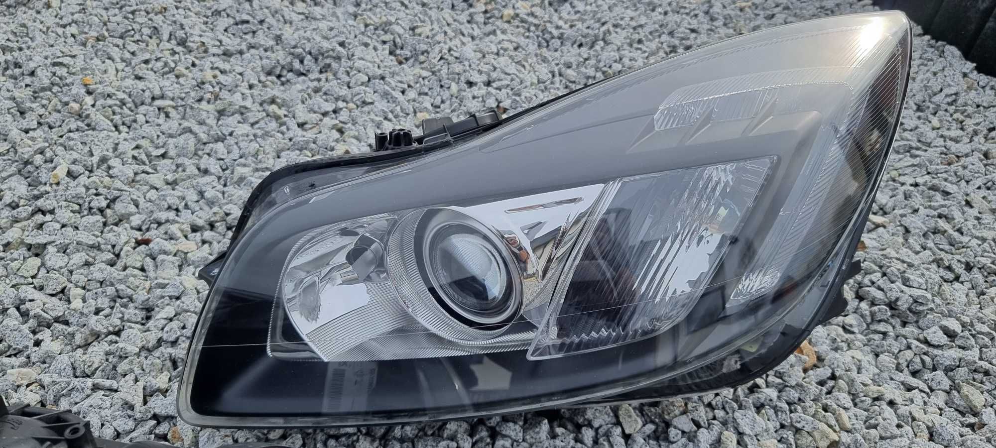 Lampy bi xenon Opel Insignia A skrętne regenerowane reflektory HELLA