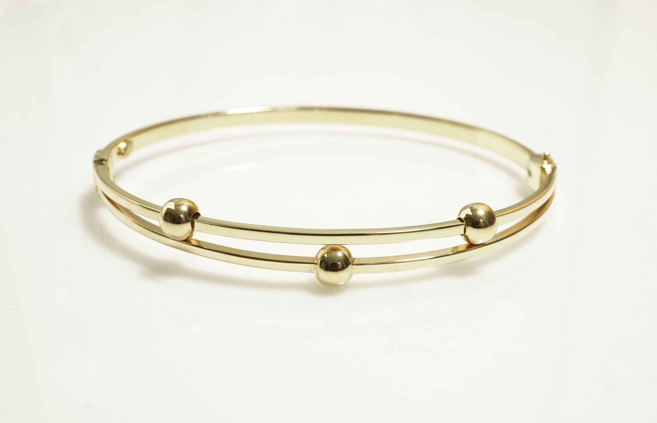 Złoto- 585 złota damska bransoletka bangle sztywna kulki