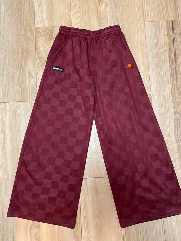 Damskie spodnie z szerokimi nogawkami Ellesse