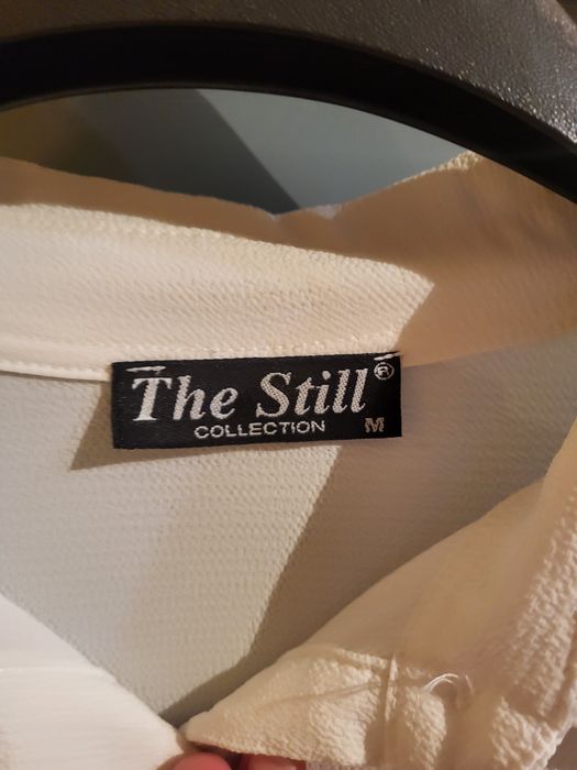 Biała koszula asymetryczna