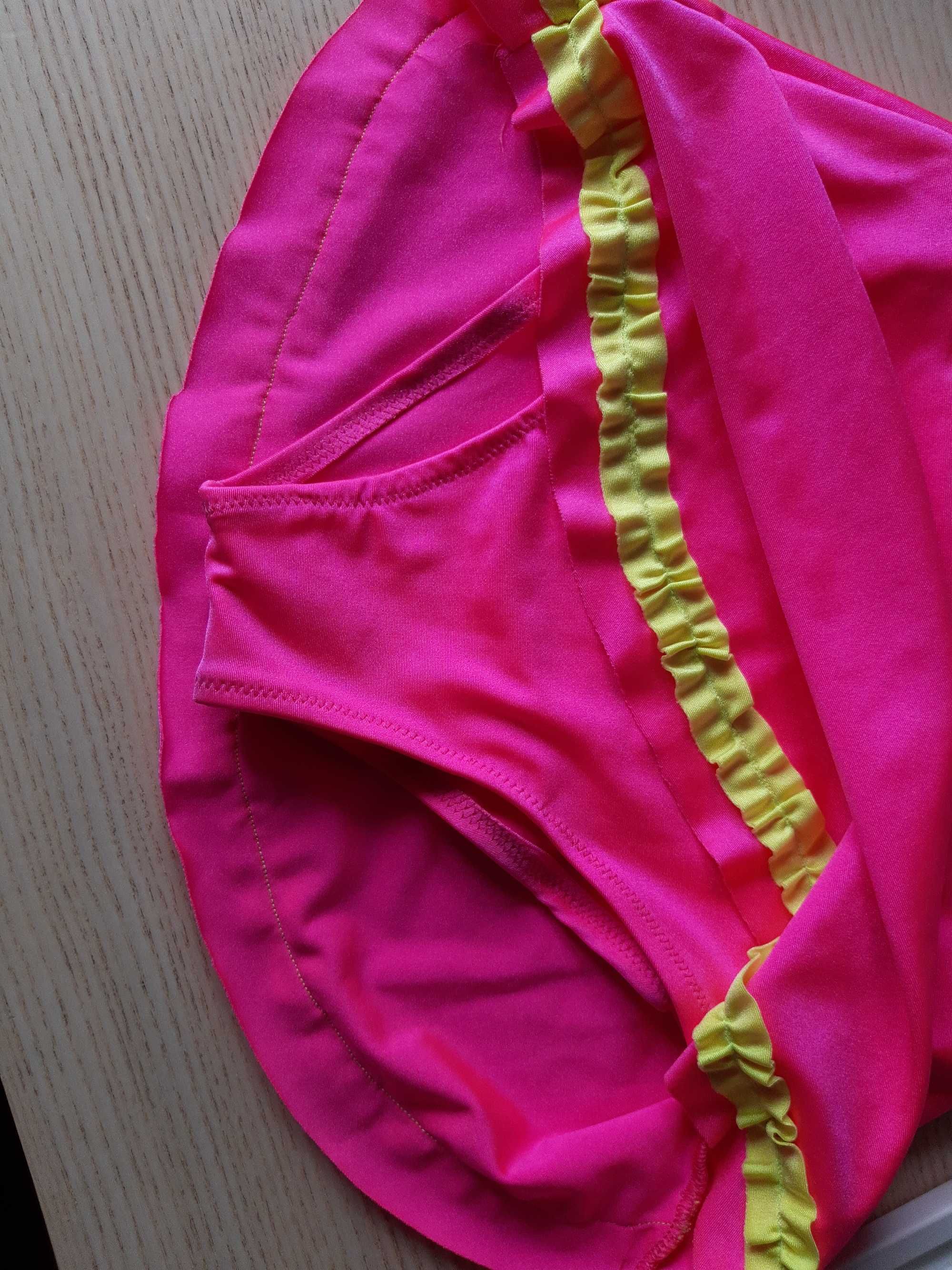 Maillot de ginástica rosa e amarelo com brilhantes