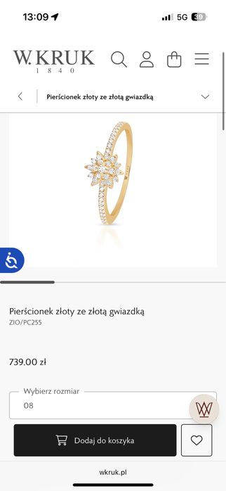 Złoty pierścionek z cyrkoniami, z gwiazdką w kruk